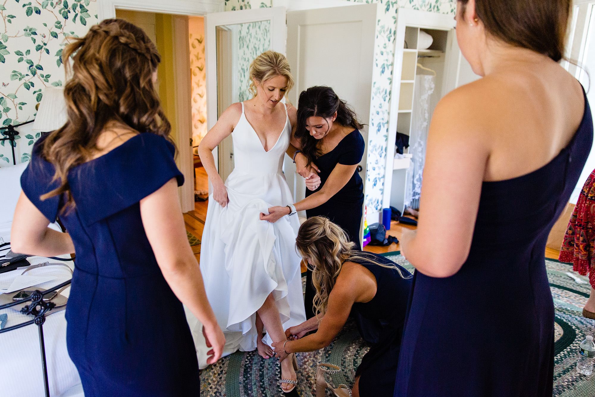 Bride getting ready with bridesmaids at the Asticou Inn for her wedding.
