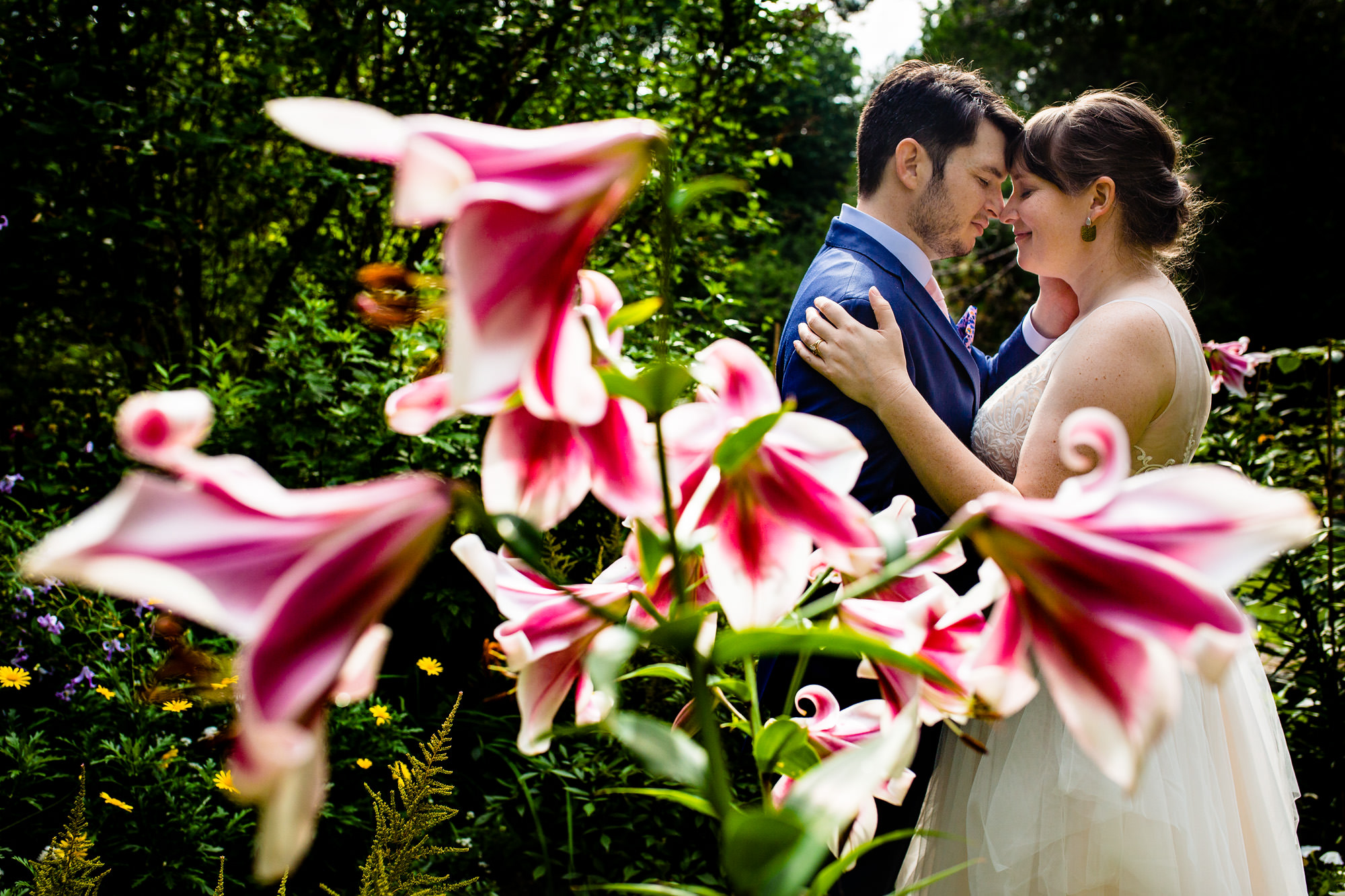 An elopement portrait in the gardens at the Vesper Hill Childrens Chapel
