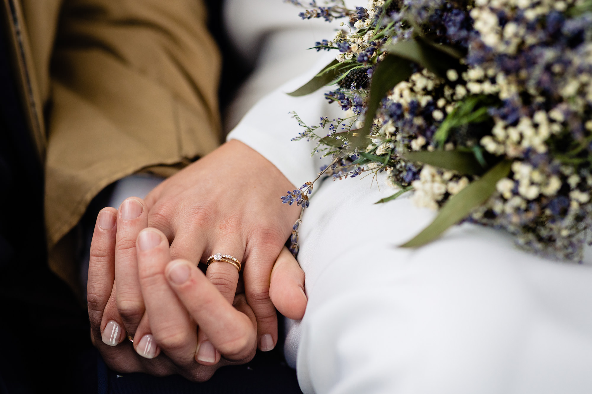 An intimate hand hold at a wedding in Boothbay Harbor, Maine