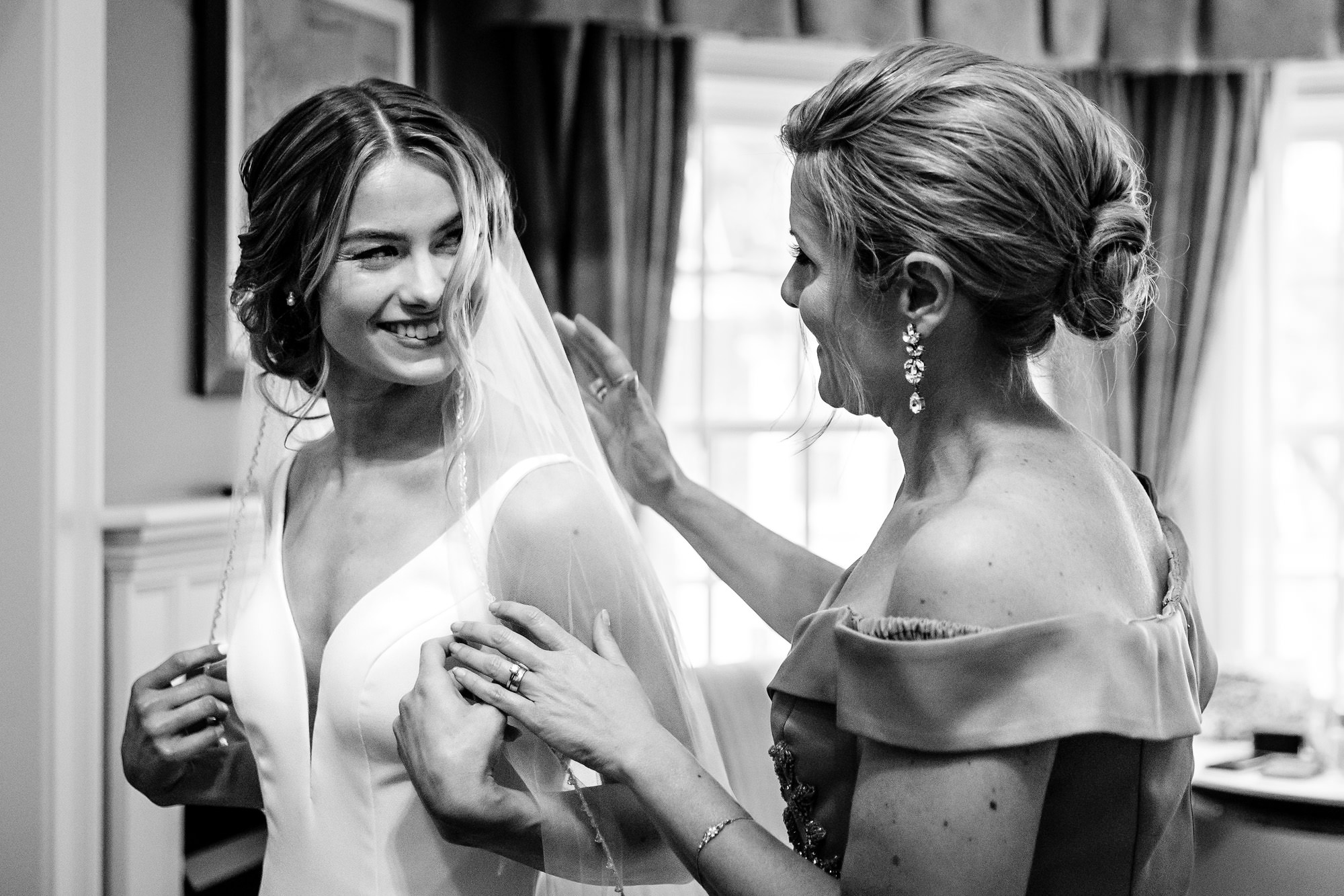 A bride prepares and gets dressed for her Bar Harbor Inn wedding.