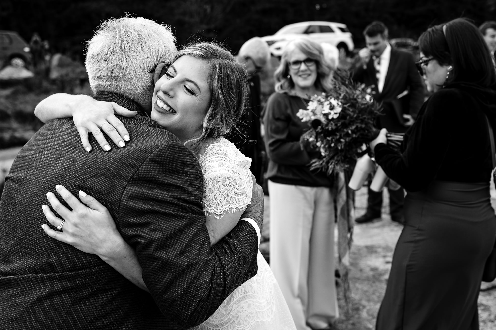 Candid photos of hugs after an elopement in Acadia National Park