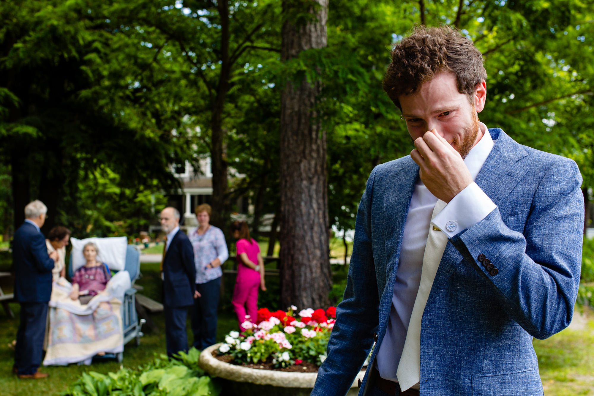 A groom cries while walking away from his dying mother.