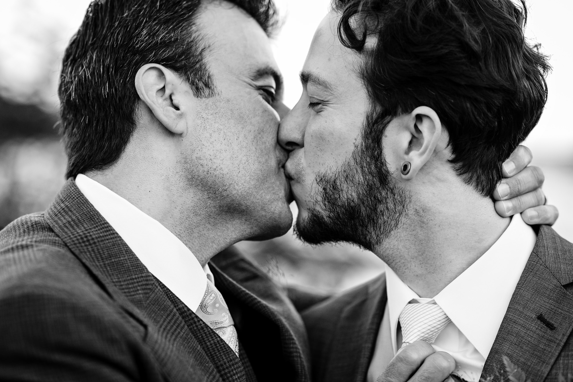 A kiss shared by two grooms at their wedding in Bar Harbor, Maine.