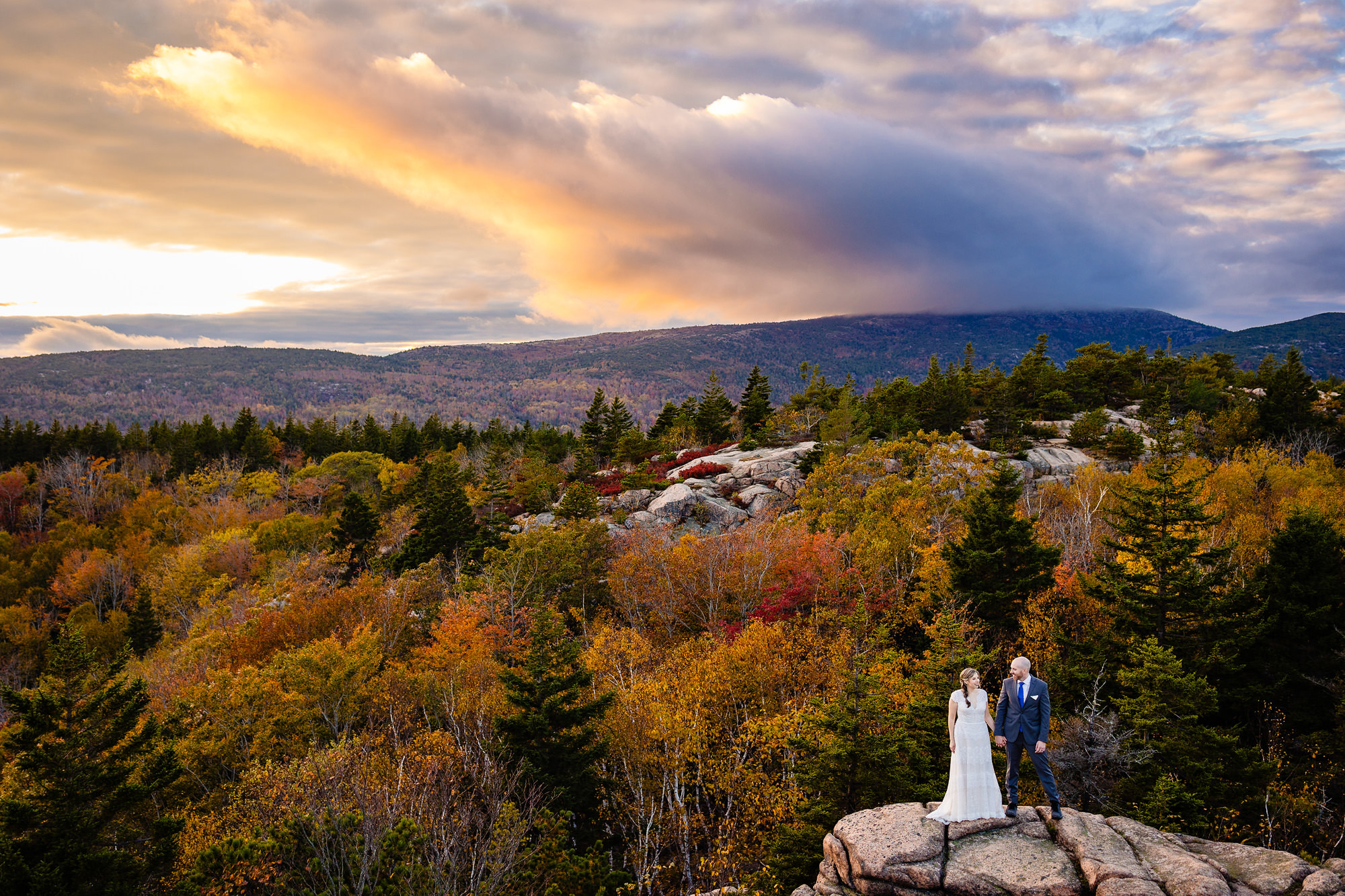 A striking sunset wedding portrait in Acadia taken in Autumn.