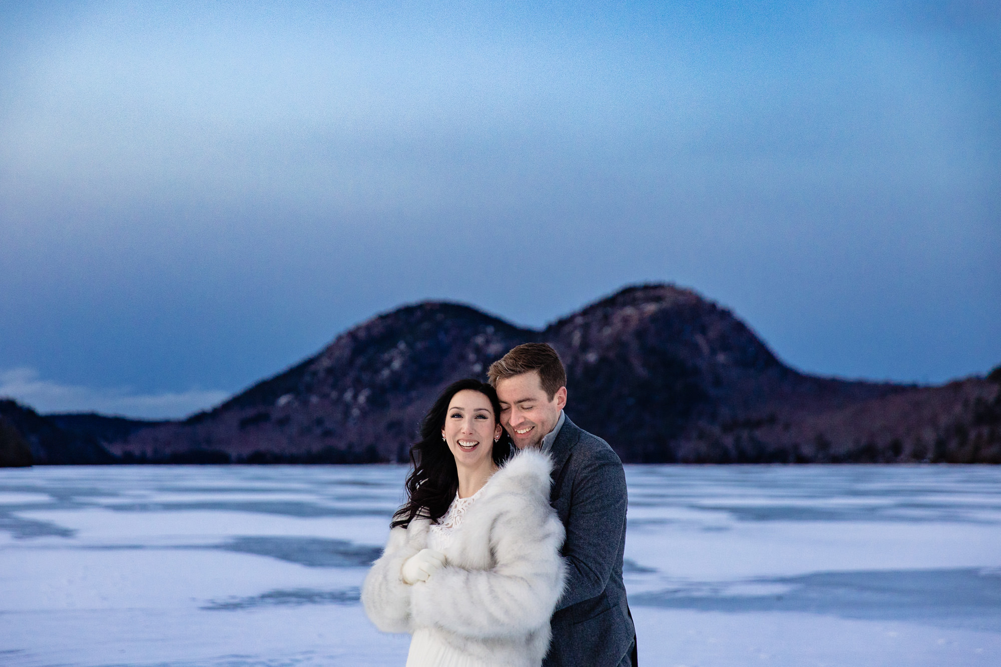 An elopement portrait taken during winter at Jordan Pond at Acadia National Park.