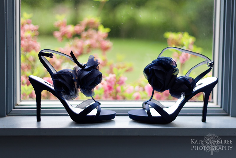 A detail shot of the bride's shoes lit by natural light