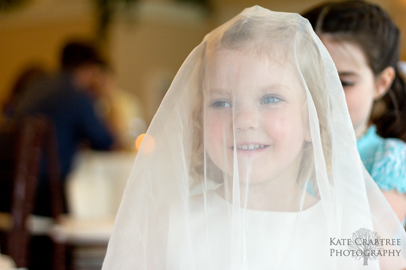 A little girl plays bride during a fun reception in Cumberland Maine