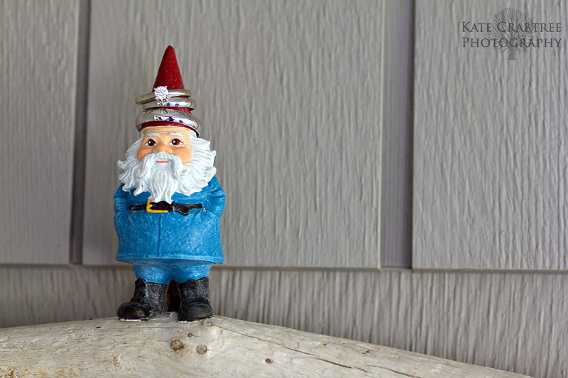 A little gnome at a Winterport house sports the brides and grooms wedding rings.