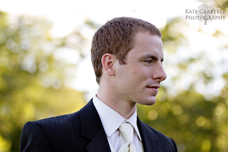The groom looks at his gorgeous bride off camera at their Winterport Maine house.