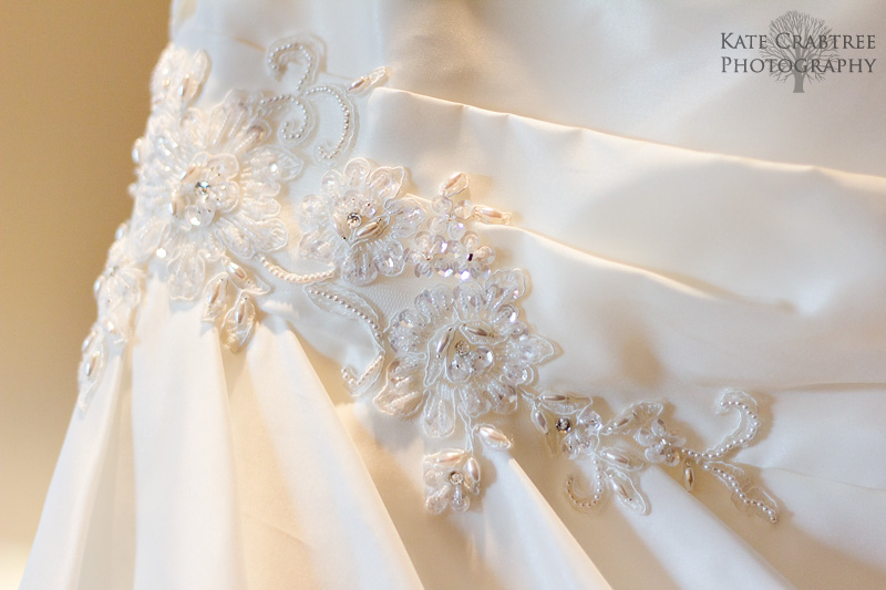 A detail wedding dress photo from a Bangor Maine wedding at the Penobscot Valley Country Club.