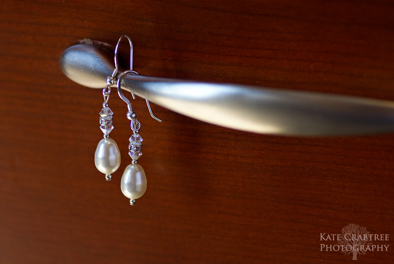 A photo of the bride's earrings at a Bangor Maine wedding at the Penobscot Valley Country Club.