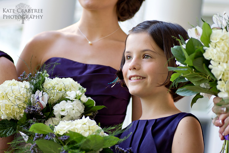 The bride's little sister poses for photos before the bride's wedding in Bangor Maine.