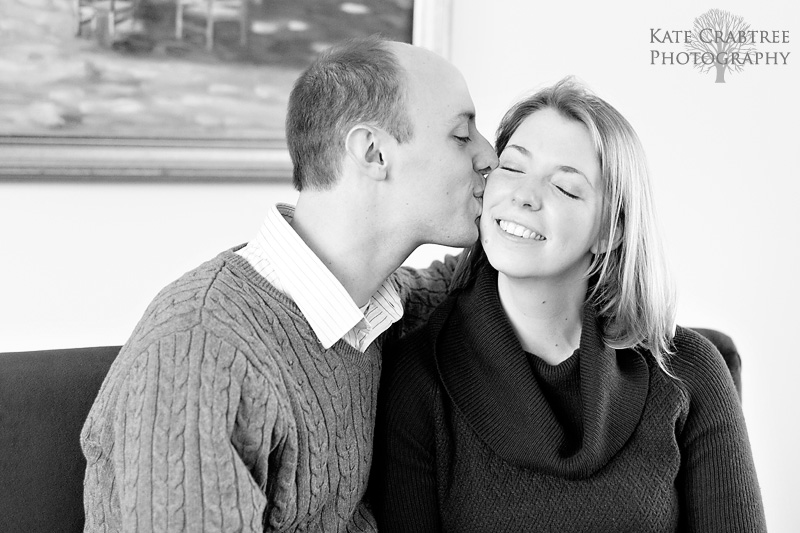 Keith kisses his future bride's cheek during their Cellardoor Winery engagement session in Maine.
