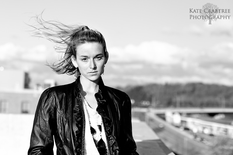 Diana stands on top of a parking garage during a fashion shoot in Maine