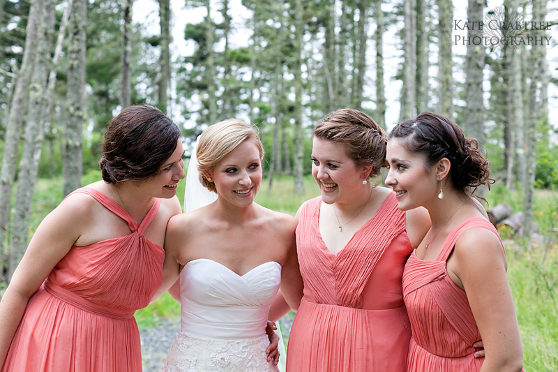 During a North Haven wedding the bride shares a moment with her bridesmaids in this photo