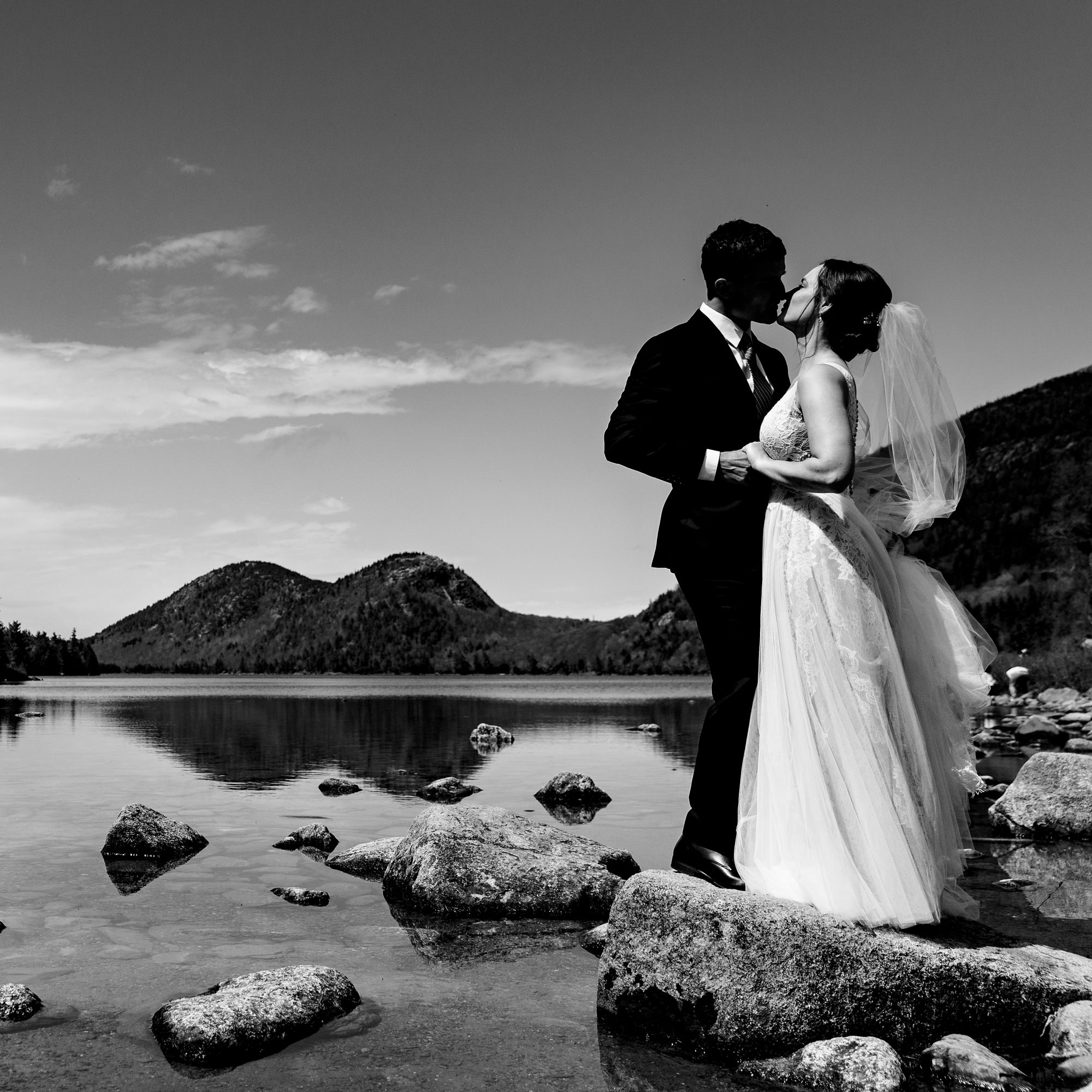 A wedding portrait in front of Jordan Pond in Acadia National Park