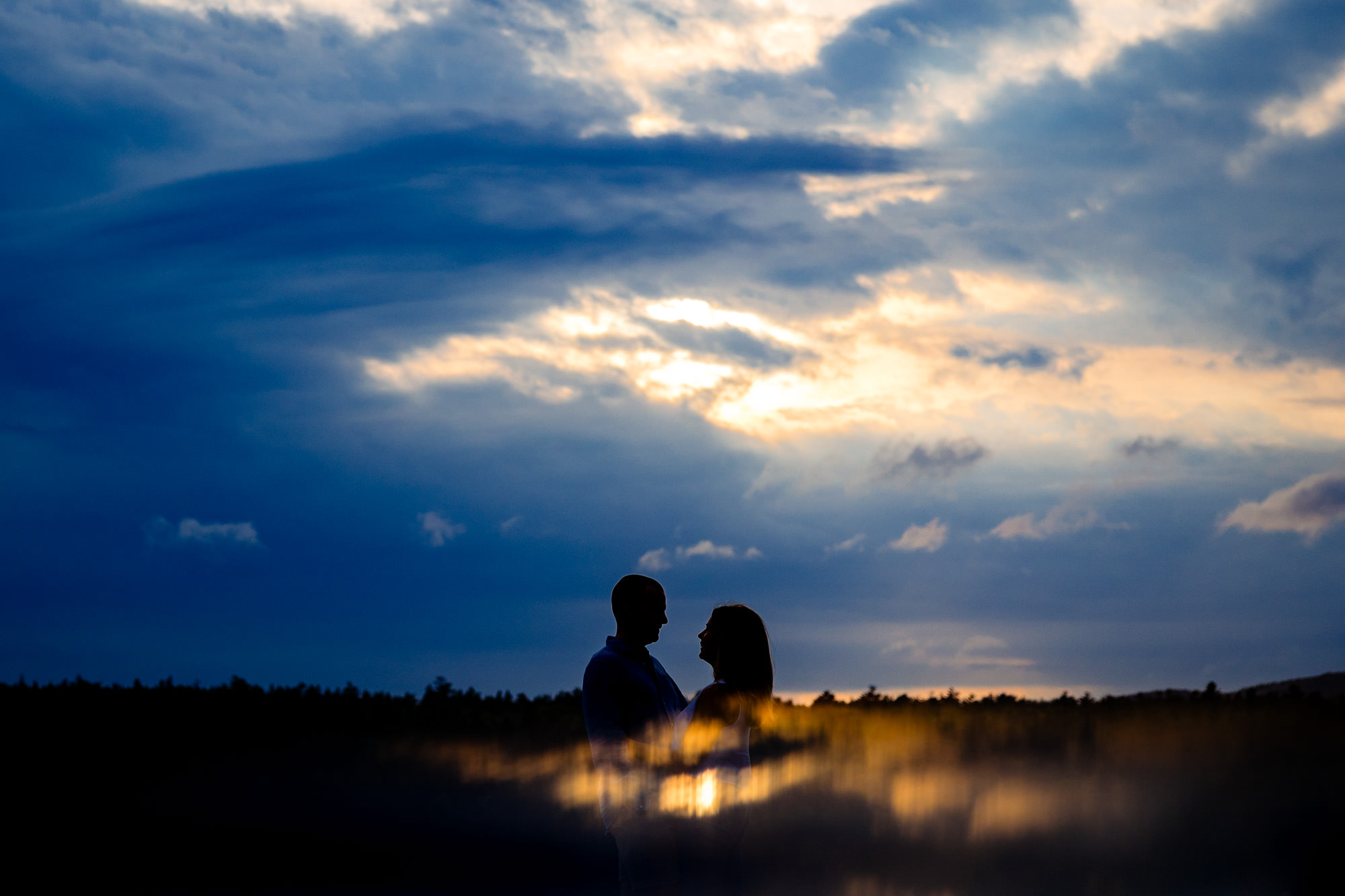 Unique silhouette engagement portrait taken in Acadia