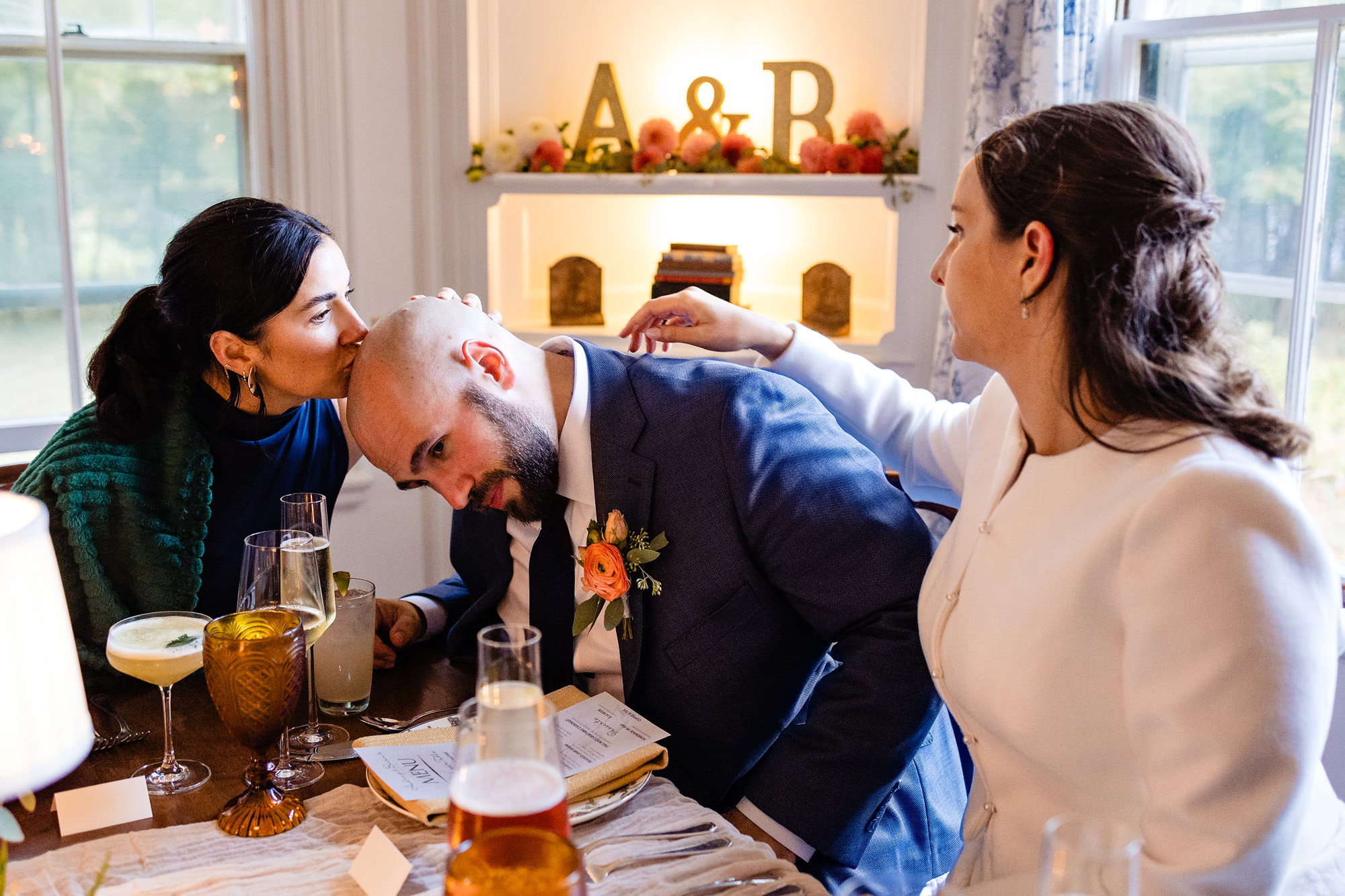 A little moment during dinner at Audrey and Brian's Bar Harbor elopement