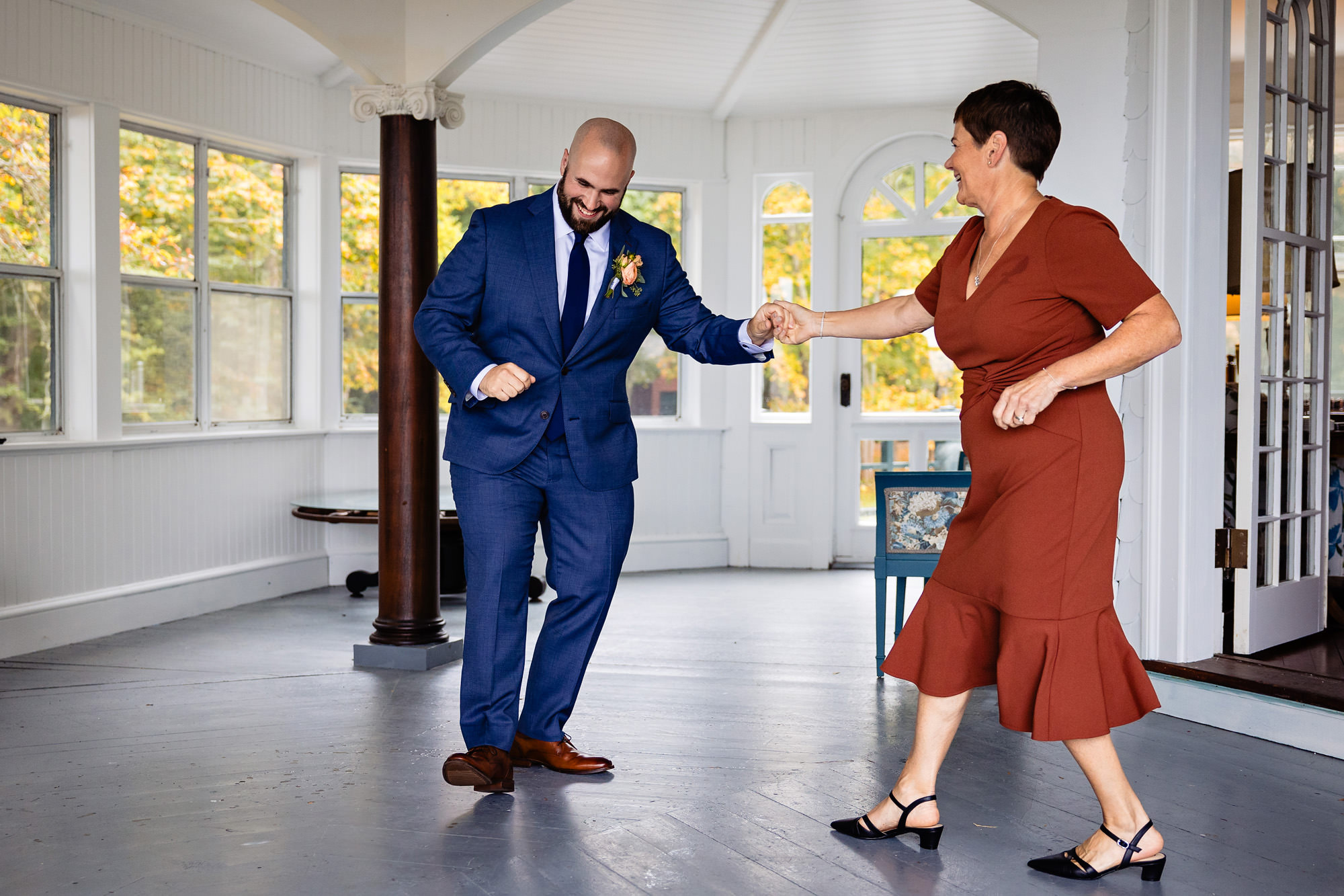 A groom and his mother dance before his Bar Harbor wedding ceremony.