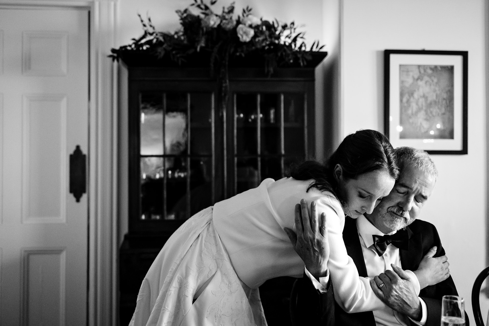 A bride hugs her father at her Bar Harbor elopement.