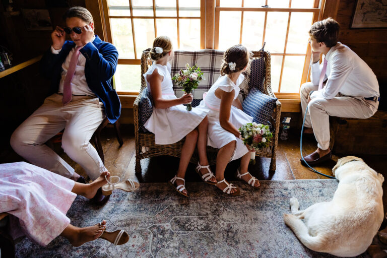 Children of the brides look out the window as they await the Seal Cove Maine ceremony to begin.