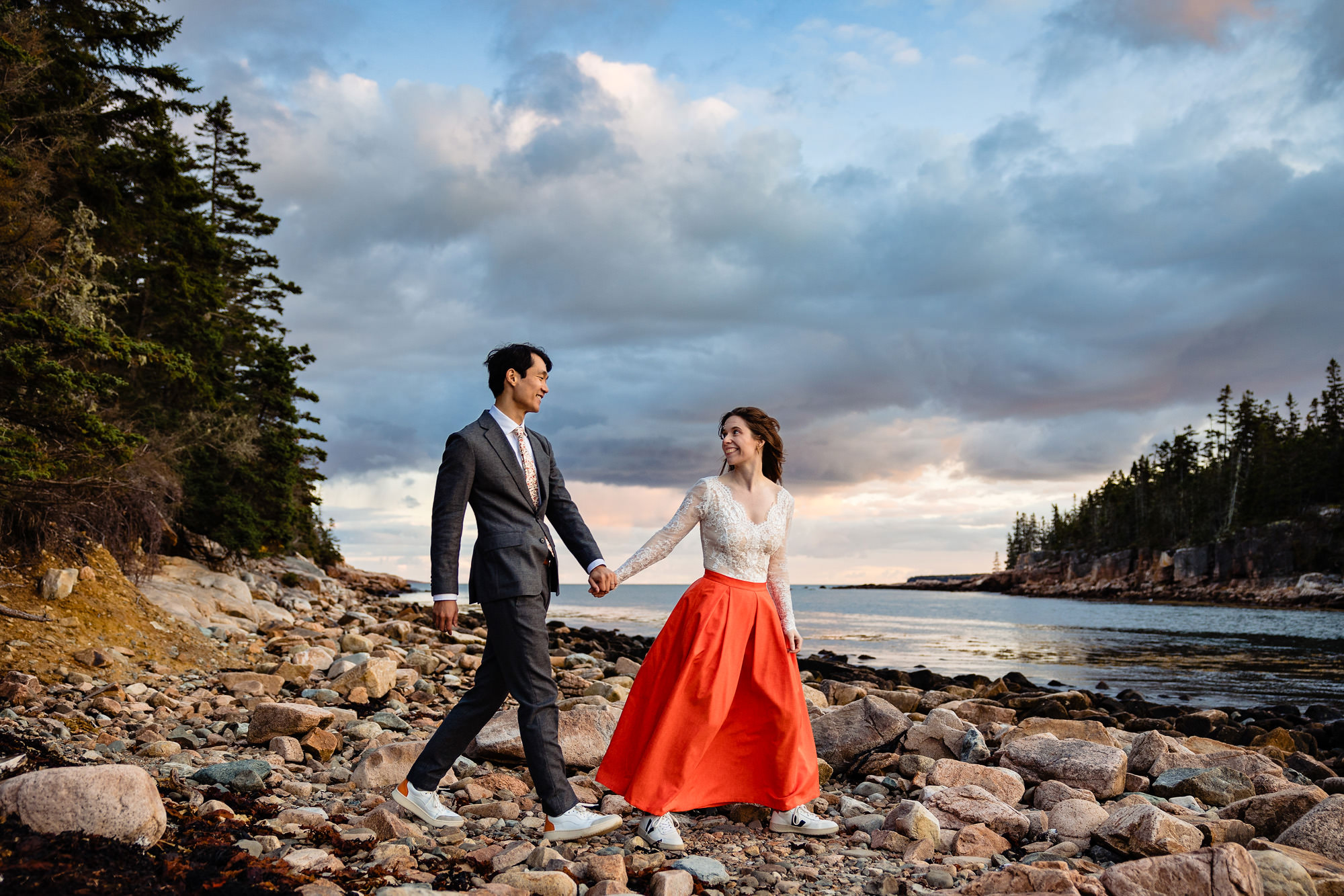 A wedding couple poses for a portrait in Acadia National Park