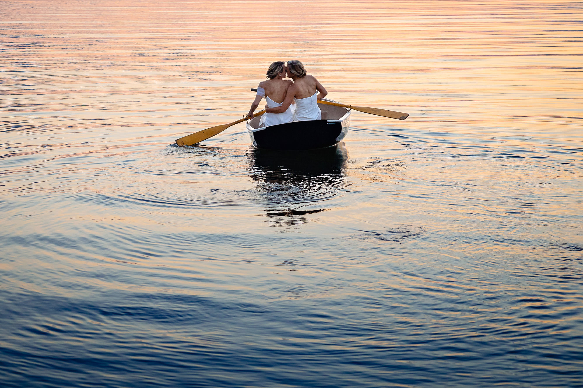 Two brides take a sunset row at their Mount Desert Island wedding