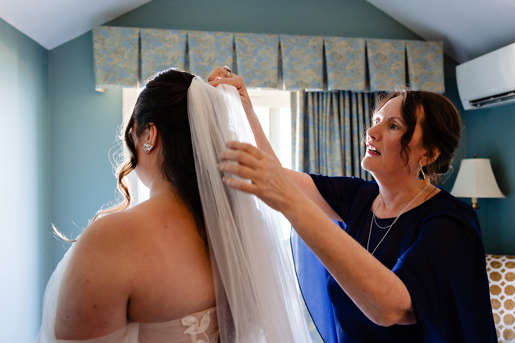 Amanda gets dressed at her Bar Harbor Inn wedding